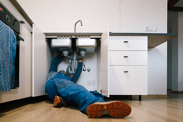 Professional Plumbing technician working in Harlan, IA